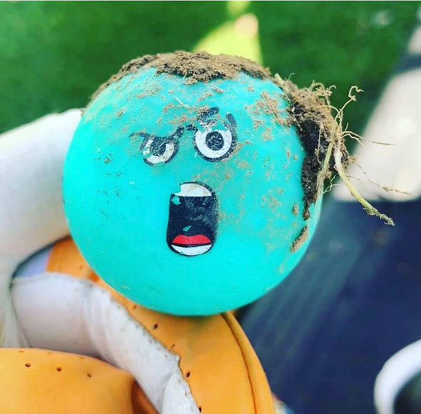 hilarious face on golf ball after being hit by golf club
