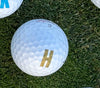 Gold Letter H on Golf Ball