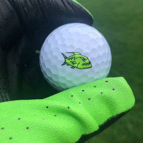 Neon green Piranha design on golf ball